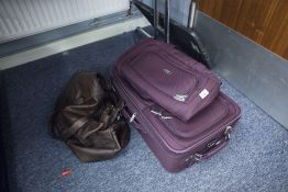 'PIERRE CARDIN' MAROON CANVAS CABIN SUITCASE, WITH EXTENDING HANDLE AND WHEELS, A MATCHING SMALL