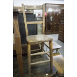 A CHILD'S OAK HIGH CHAIR