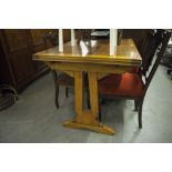 AN OAK OBLONG DRAW-LEAF DINING TABLE, ON END STANDARDS