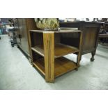 AN OAK TWO TIER BOOK TABLE/ COFFEE TABLE WITH CANTED CORNERS