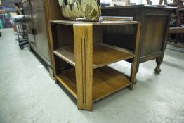 AN OAK TWO TIER BOOK TABLE/ COFFEE TABLE WITH CANTED CORNERS