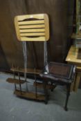 A BLACK FINISH DISPLAY CABINET WITH OPEN SHELVES AND A CUPBOARD BASE