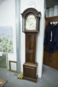 A REPRODUCTION MAHOGANY CASED LONGCASE CLOCK, the arched brass dial dated 1981