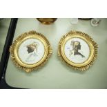 A PAIR OF FRENCH OVAL PRINTS, NINETEENTH CENTURY LADIES IN DRESSING IN GILT FRAMES WITH BOW AND