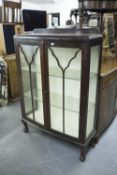 GEORGIAN STYLE MAHOGANY CHINA DISPLAY CABINET WITH SLIGHTLY BOWED FRONT AND BALL AND CLAW FEET