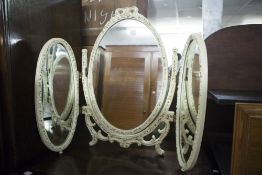 A LARGE OBLONG BEVELLED WALL MIRROR IN GILT FRAME AND AN OVAL TRIPLE TOILET MIRROR