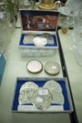 A SET OF EIGHT CAVALIER SILVER PLATE MATS AND TWELVE MATCHING COASTERS