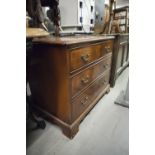 SMALL LOW GEORGIAN STYLE MAHOGANY CHEST OF THREE GRADUATED DRAWERS WITH SWAN NECK LOOP HANDLES ON
