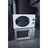 A SWAN MICROWAVE OVEN AND A PACIFIC GREY MICROWAVE OVEN (2)