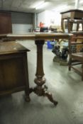 VICTORIAN MAHOGANY OCCASIONAL TABLE WITH OCTAGONAL TOP TURNED COLUMN AND FOUR SCROLL SUPPORTS (A.F.)