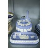 WEDGWOOD PALE BLUE AND WHITE JASPERWARE LARGE CIRCULAR BOX AND COVER; A SMALLER BOX AND COVER; A
