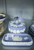 WEDGWOOD PALE BLUE AND WHITE JASPERWARE LARGE CIRCULAR BOX AND COVER; A SMALLER BOX AND COVER; A