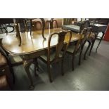 A WALNUTWOOD QUEEN ANNE STYLE DINING ROOM TABLE AND SIX SINGLE CHAIRS