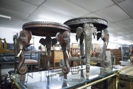 A LATE NINETEENTH CENTURY INDIAN CARVED CIRCULAR TABLE ON ELEPHANT HEADED SUPPORTS AND TWO SMALLER