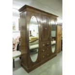 LATE NINETEENTH CENTURY INLAID OAK BEACONSFIELD TYPE WARDROBE WITH TWO OVAL MIRROR PANEL DOORS (A.