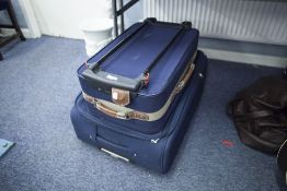 'CALVIN KLEIN', LARGE BLUE CANVAS SUITCASE WITH WHEELS 30" X 20" AND AN 'EQUATER' BLACK CANVAS AND