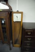 A POST CARD GENTS OF LEICESTER ELECTRIC WOODEN CASED WALL CLOCK, 50 3/4" (129cm) HIGH