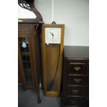 A POST CARD GENTS OF LEICESTER ELECTRIC WOODEN CASED WALL CLOCK, 50 3/4" (129cm) HIGH