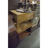CIRCA 1960's TEAKWOOD HINGE TOP WORKBOX, ON TAPERING LEGS AND A TWO TIER TEA TROLLEY WITH SWIVEL AND