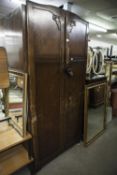 A GENTS OAK TWO DOOR SEMI-FITTED WARDROBE