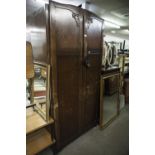 A GENTS OAK TWO DOOR SEMI-FITTED WARDROBE