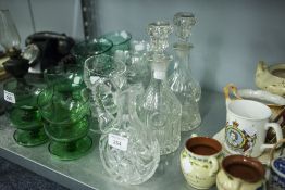 A PAIR OF VICTORIAN GLASS MALLET SHAPED DECANTERS AND A CUT GLASS CLARET JUG (3)