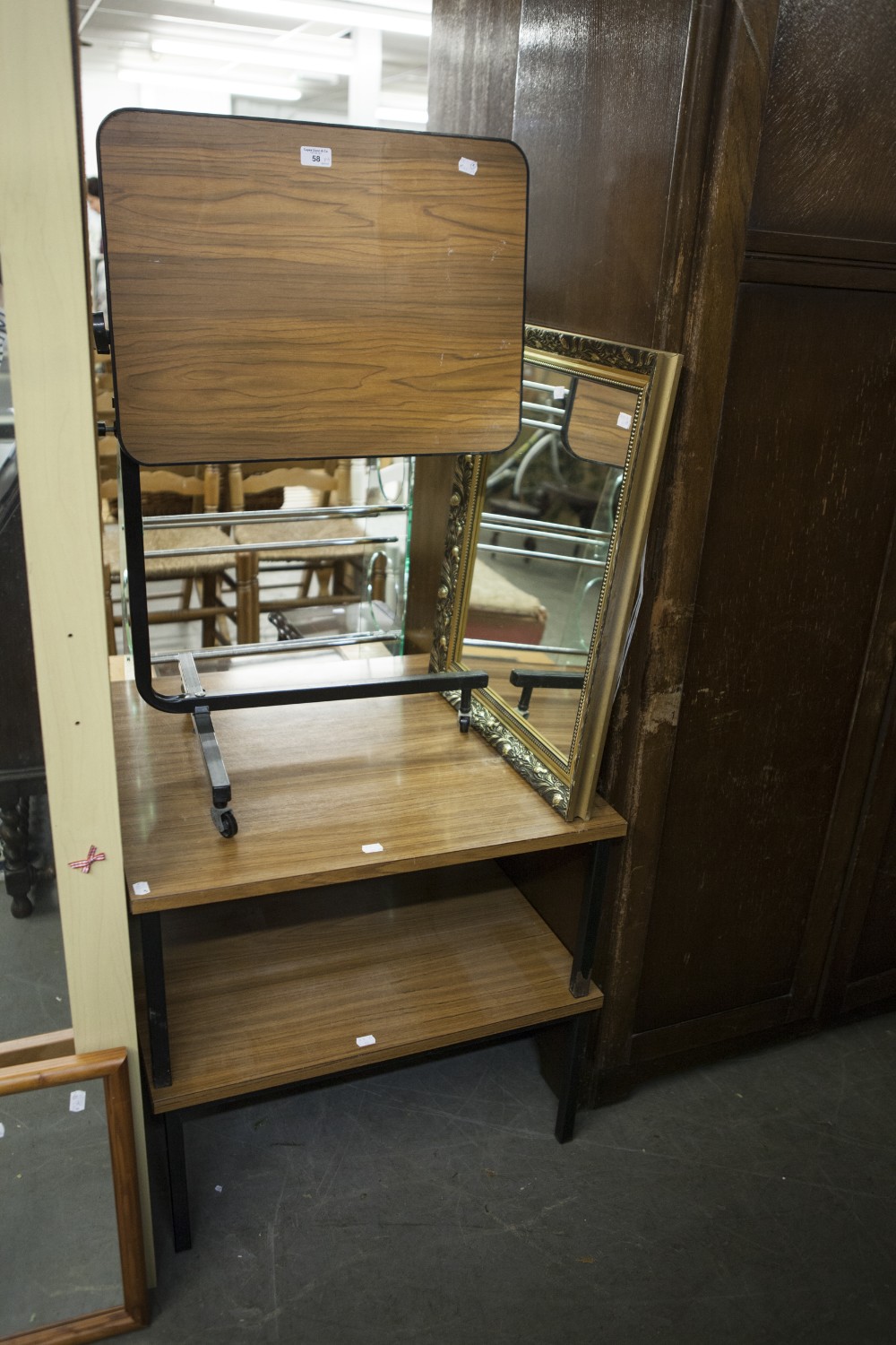 AN OBLONG WALL MIRROR IN GILT FOLIATE FRAME; AN ADJUSTABLE CANTILEVER TABLE AND TWO HOMEMADE