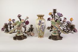 A PAIR OF MODERN REPRODUCTION CERAMIC AND GILT METAL MOUNTED CANDELABRA'S, MODELLED WITH FLOWERS AND