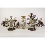 A PAIR OF MODERN REPRODUCTION CERAMIC AND GILT METAL MOUNTED CANDELABRA'S, MODELLED WITH FLOWERS AND