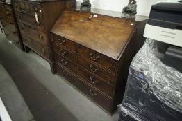 GEORGE III MAHOGANY BUREAU, WITH SLOPING FALL FRONT OVER TWO SHORT AND THREE GRADUATED LONG