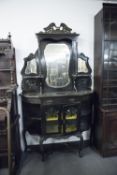 AN EDWARDIAN STAINED BEECHWOOD MIRROR BACK DISPLAY CABINET