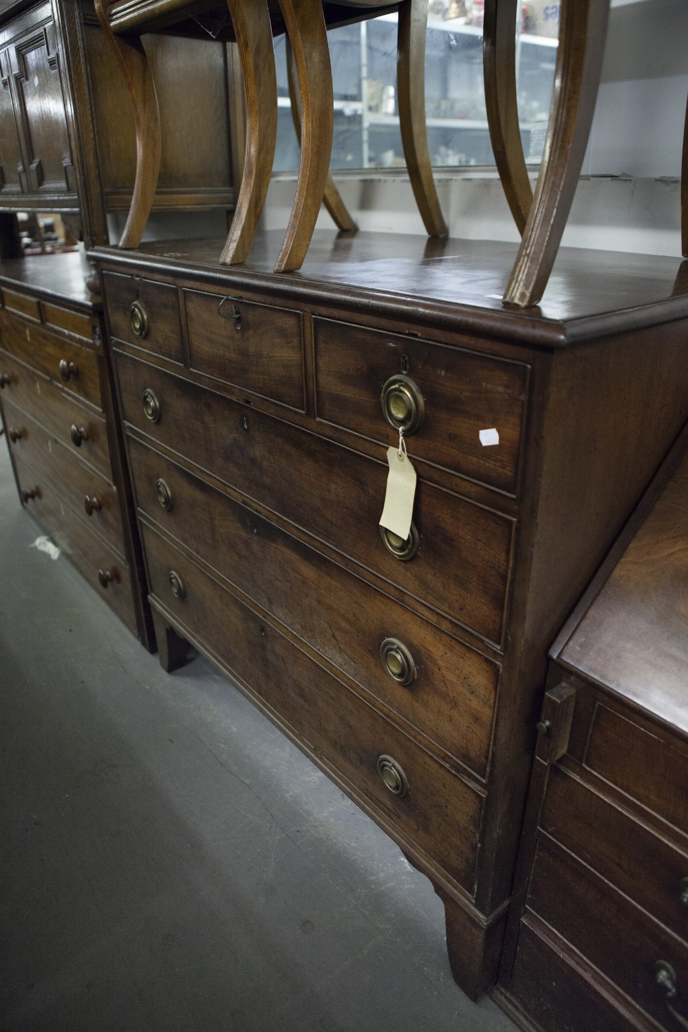 GEORGE III MAHOGANY CHEST OF THREE SHORT AND THREE GRADUATED LONG DRAWERS, ON SPLAY BRACKET FEET AND