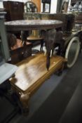 COFFEE TABLE, ON ELEPHANT HEADED SUPPORTS, ALSO A CARVED INDIAN OVAL TABLE ON SUPPORTS AS ABOVE (2)