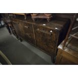 AN ART DECO DARK BURR WOOD DINING ROOM SUITE OF SIDEBOARD WITH CUPBOARD ENDS AND THREE CENTRAL