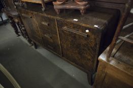 AN ART DECO DARK BURR WOOD DINING ROOM SUITE OF SIDEBOARD WITH CUPBOARD ENDS AND THREE CENTRAL