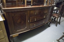 EARLY TWENTIETH CENTURY BOW FRONTED MAHOGANY MIRROR BACK SIDEBOARD, WITH QUARTER CUT CUPBOARD