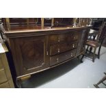 EARLY TWENTIETH CENTURY BOW FRONTED MAHOGANY MIRROR BACK SIDEBOARD, WITH QUARTER CUT CUPBOARD