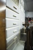 AN EARLY TWENTIETH CENTURY KITCHEN LARGER CUPBOARD, A DROP LEAF TABLE AND TALL CHEST OF DRAWERS,