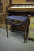 A BEECHWOOD PIANO STOOL WITH UPHOLSTERED BOX SEAT