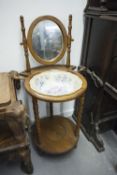 AN EARLY TWENTIETH CENTURY OAK WASH BASIN STAND