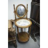 AN EARLY TWENTIETH CENTURY OAK WASH BASIN STAND