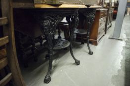 TWO WOODEN TOPPED CAST IRON BRITANNIA PUB TABLES