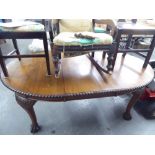 A MAHOGANY OVAL EXTENDING DINING TABLE, OF CHIPPENDALE STYLE WITH GADROON CARVED EDGE ON FOUR