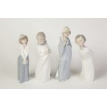 FOUR NAO, SPANISH PORCELAIN STANDING FIGURES OF YOUNG CHILDREN, 10 3/4" (27.3cm) high and smaller,