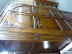 A VICTORIAN OAK HALLROBE, CANTED CORNERS, CARVED DETAIL WITH GOTHIC DESIGN TO THE SOLID DOORS