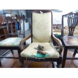 AN EARLY VICTORIAN MAHOGANY ROCKING CHAIR WITH SCROLL ARMS