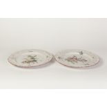 PAIR OF NINETEENTH CENTURY FRENCH FAIENCE POTTERY RIBBON PLATES, with floral painted centres, 9" (