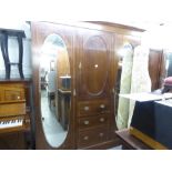 LATE NINETEENTH CENTURY INLAID OAK BEACONSFIELD TYPE WARDROBE WITH TWO OVAL MIRROR PANEL DOORS (A.
