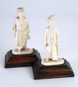 PAIR OF MALAYAN CARVED IVORY FIGURES OF MEN, both modelled standing in traditional robes and
