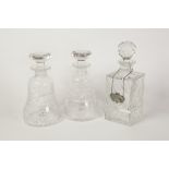 PAIR OF STUART CUT GLASS DECANTERS AND STOPPERS, each of bell form with flat topped stopper, 8 3/